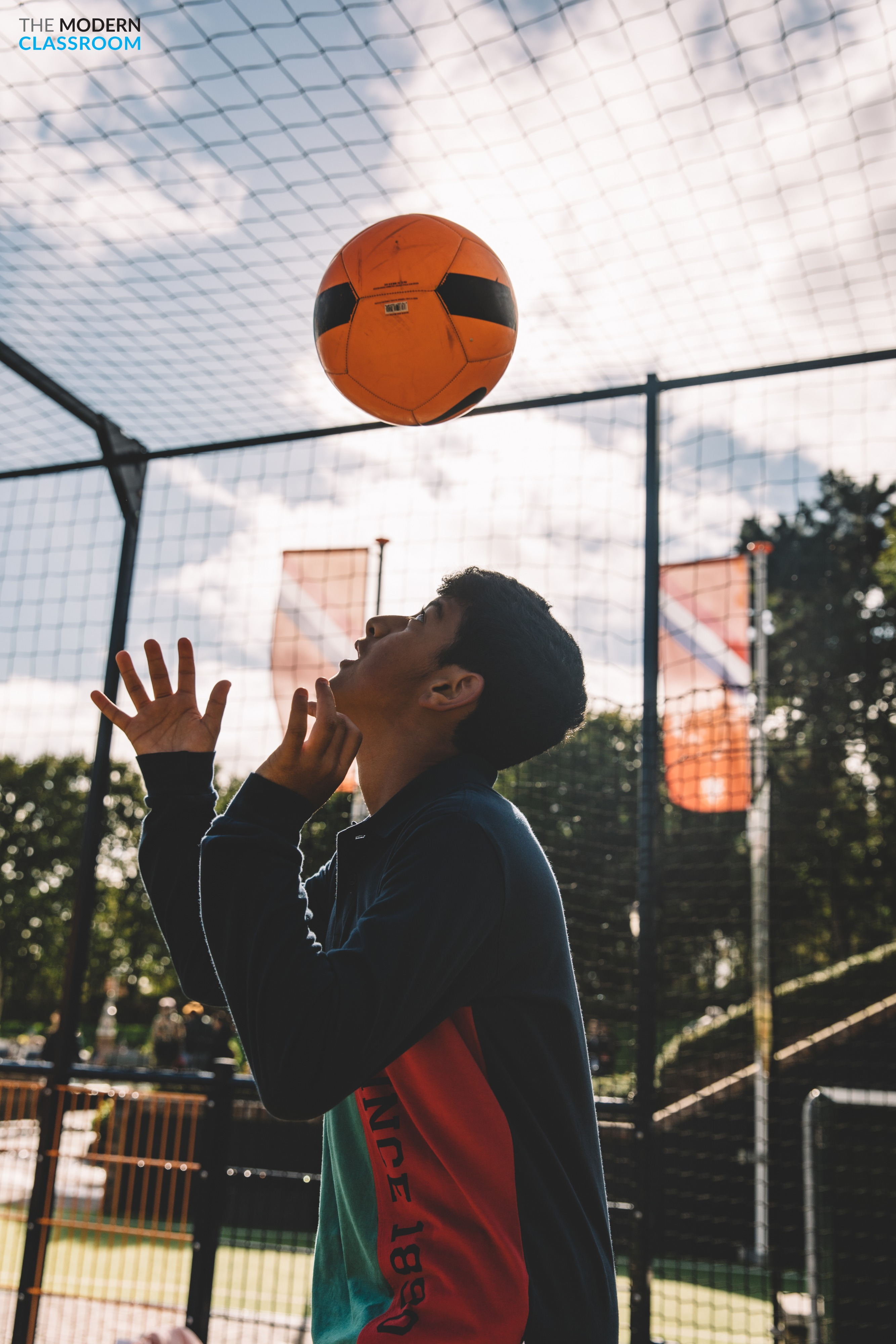 Students on an outdoor basketball court during an international program