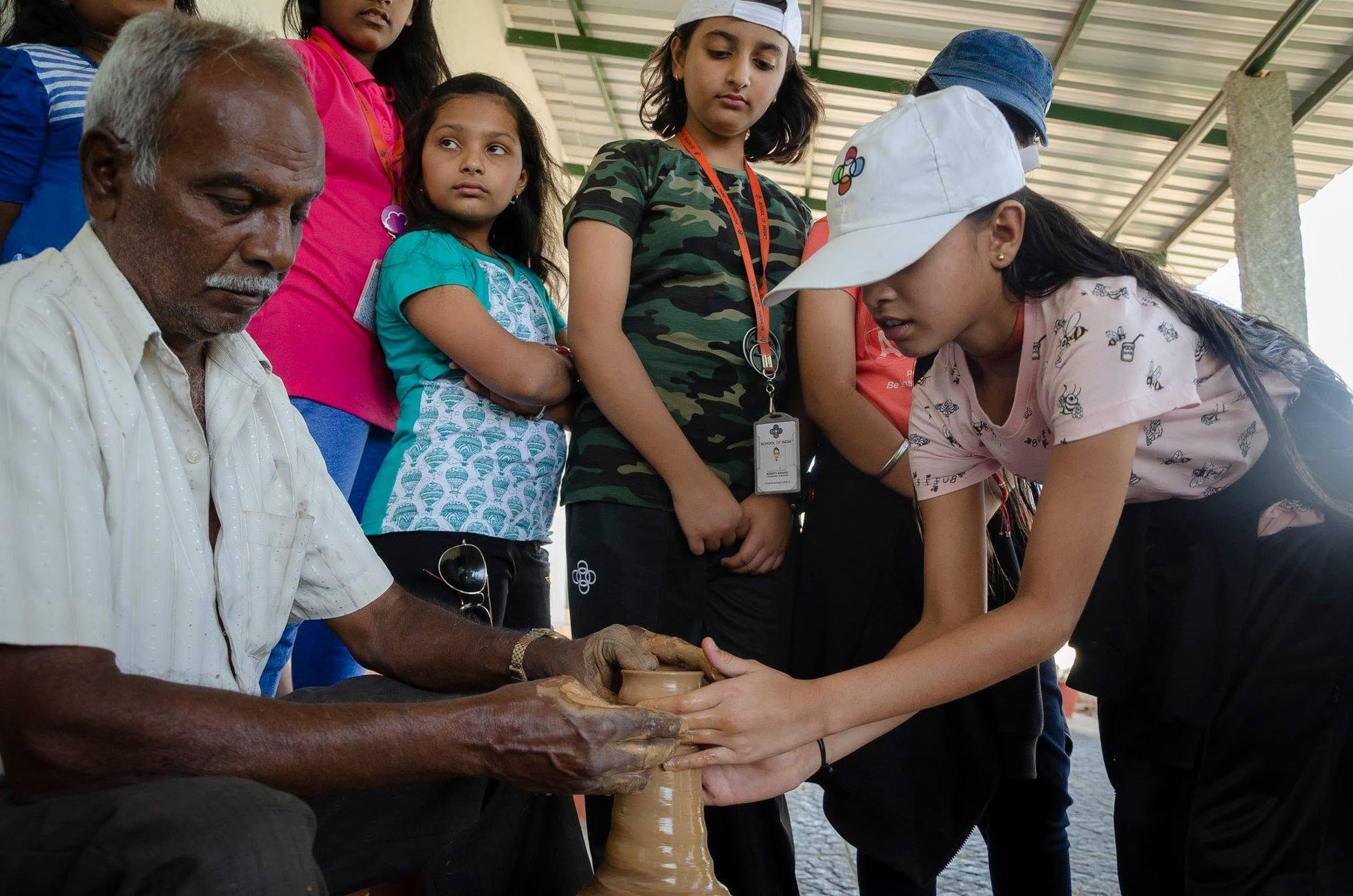 Students learning pottery during a domestic curriculum-aligned immersion
