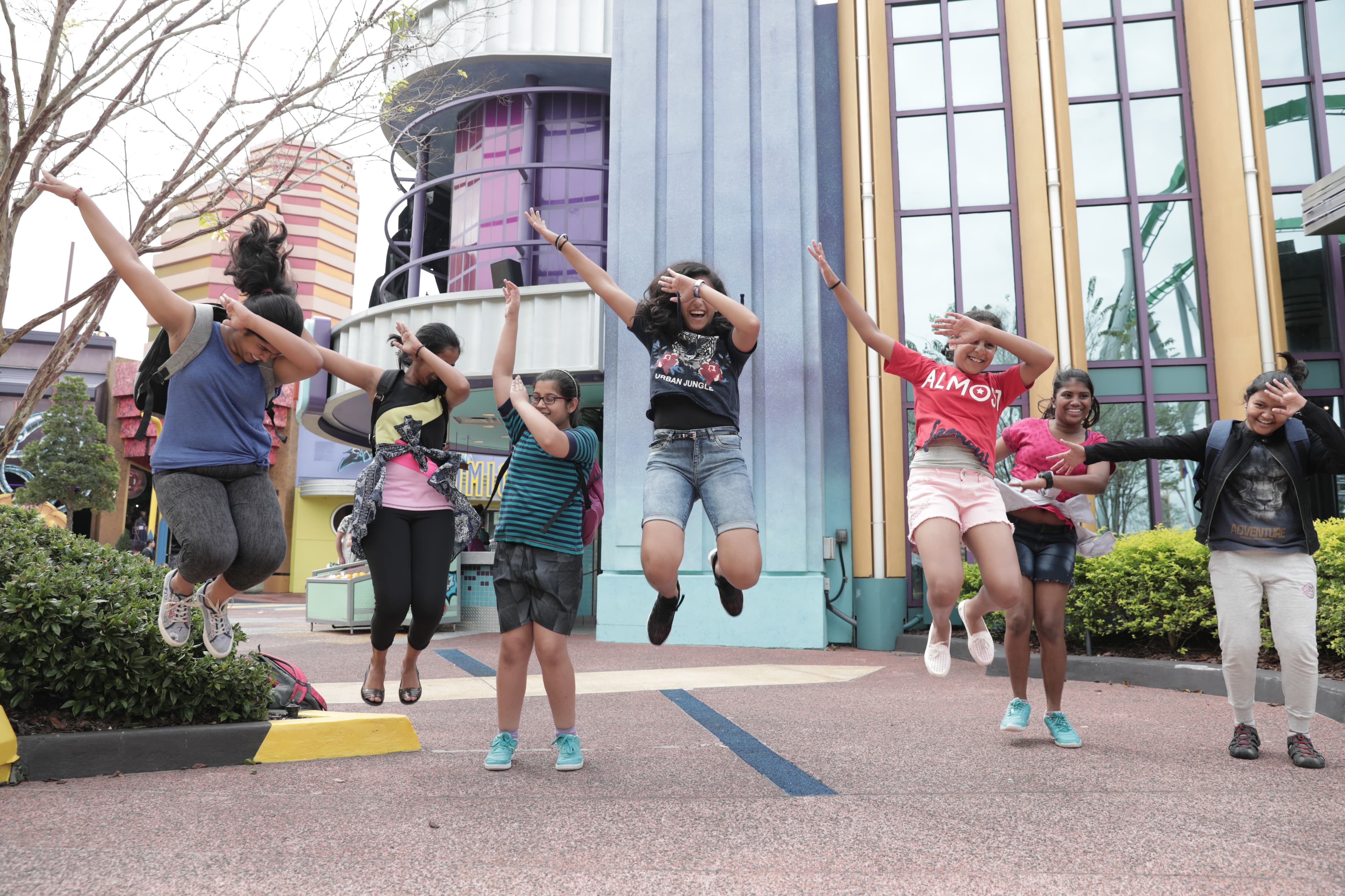 Students jumping together during an international educational immersion program